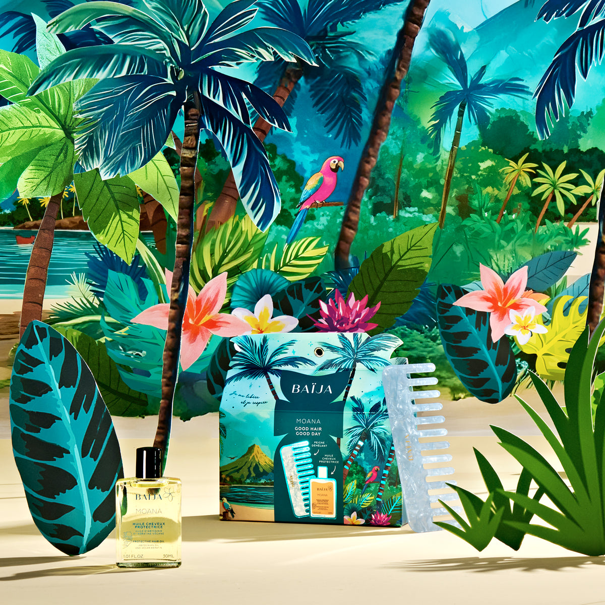 Coffret Good Hair Good Day Moana contenant: une huile cheveux protectrice et un peigne, sur fond coloré de la collection noël Moana.