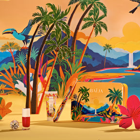 Coffret nail glitter party lost paradise contenant: une lime à ongles, une crème mains, un vernis rouge et des paillettes argentées. 