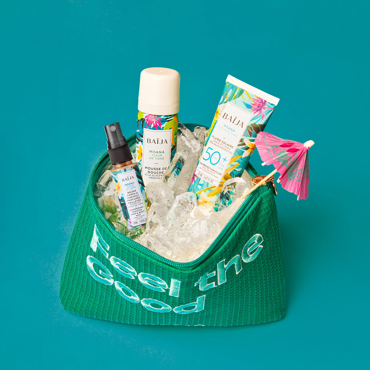 Coffret solaire Baïja Moana avec trousse offerte, comprenant mousse de douche, fluide solaire SPF50+ et brume corps & cheveux pailletée.