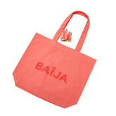 Sac cabas Baïja Sweet Sunday rose corail avec logo bouclette, anses épaules et étiquette de collection assortie