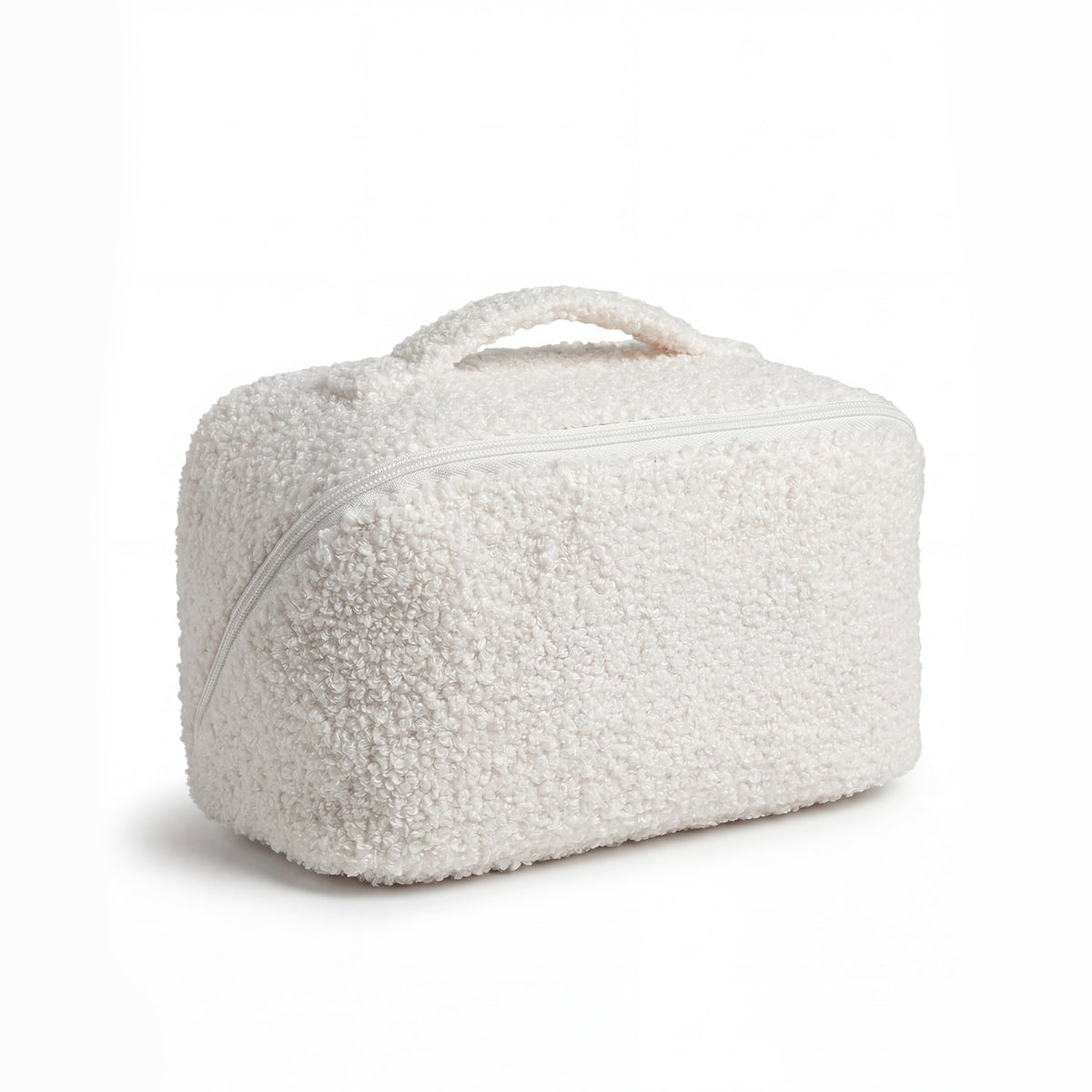 Vanity de rangement beauté en bouclette écrue, format voyage avec poignée intégrée et fermeture zippée