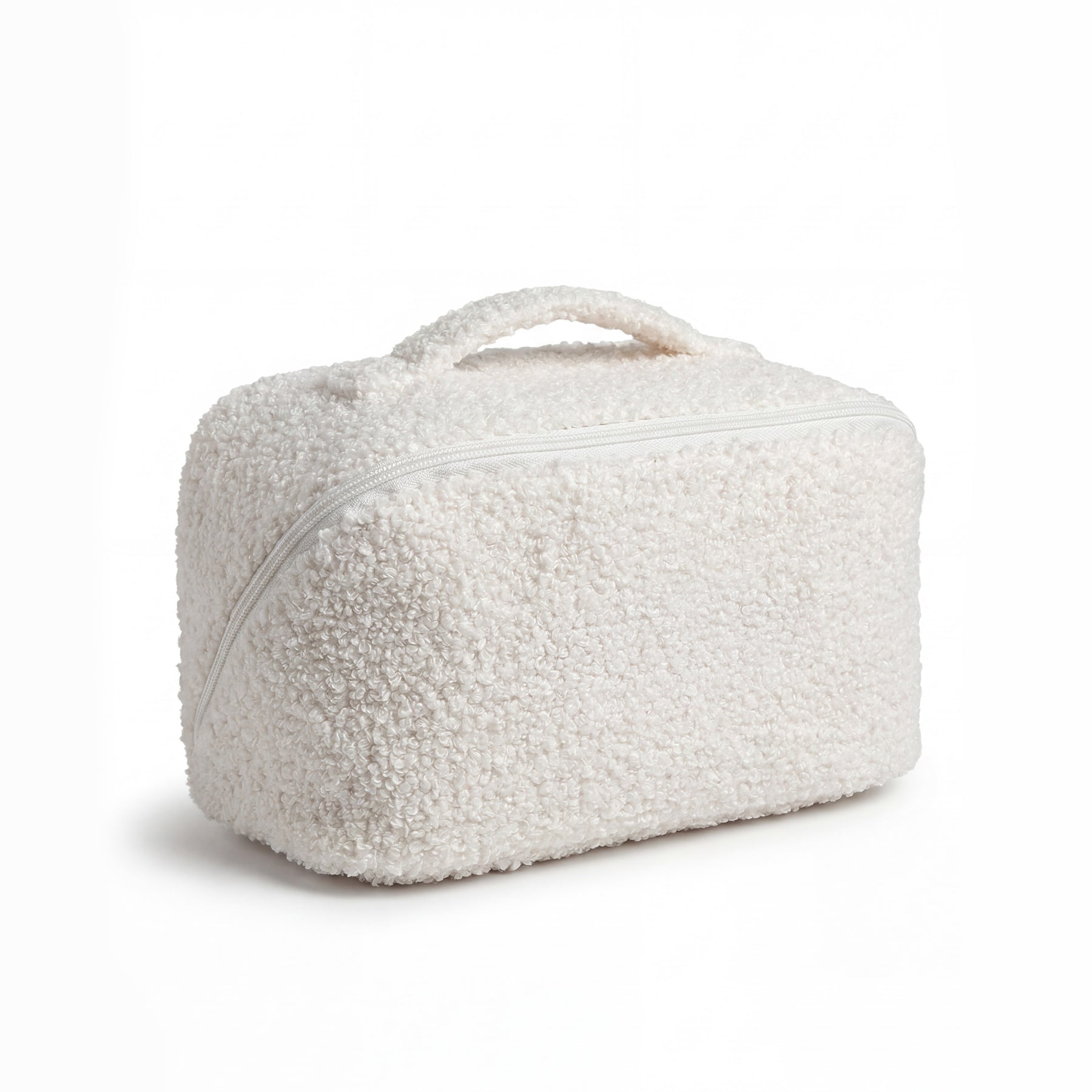 Vanity de rangement beauté en bouclette écrue, format voyage avec poignée intégrée et fermeture zippée